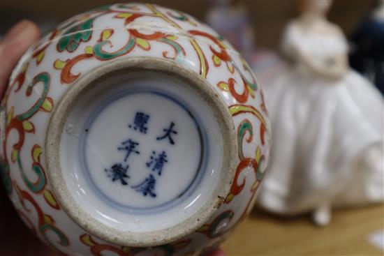 A Chinese blue and white large tripod censer, a peach bloom brush washer and a famille verte vase